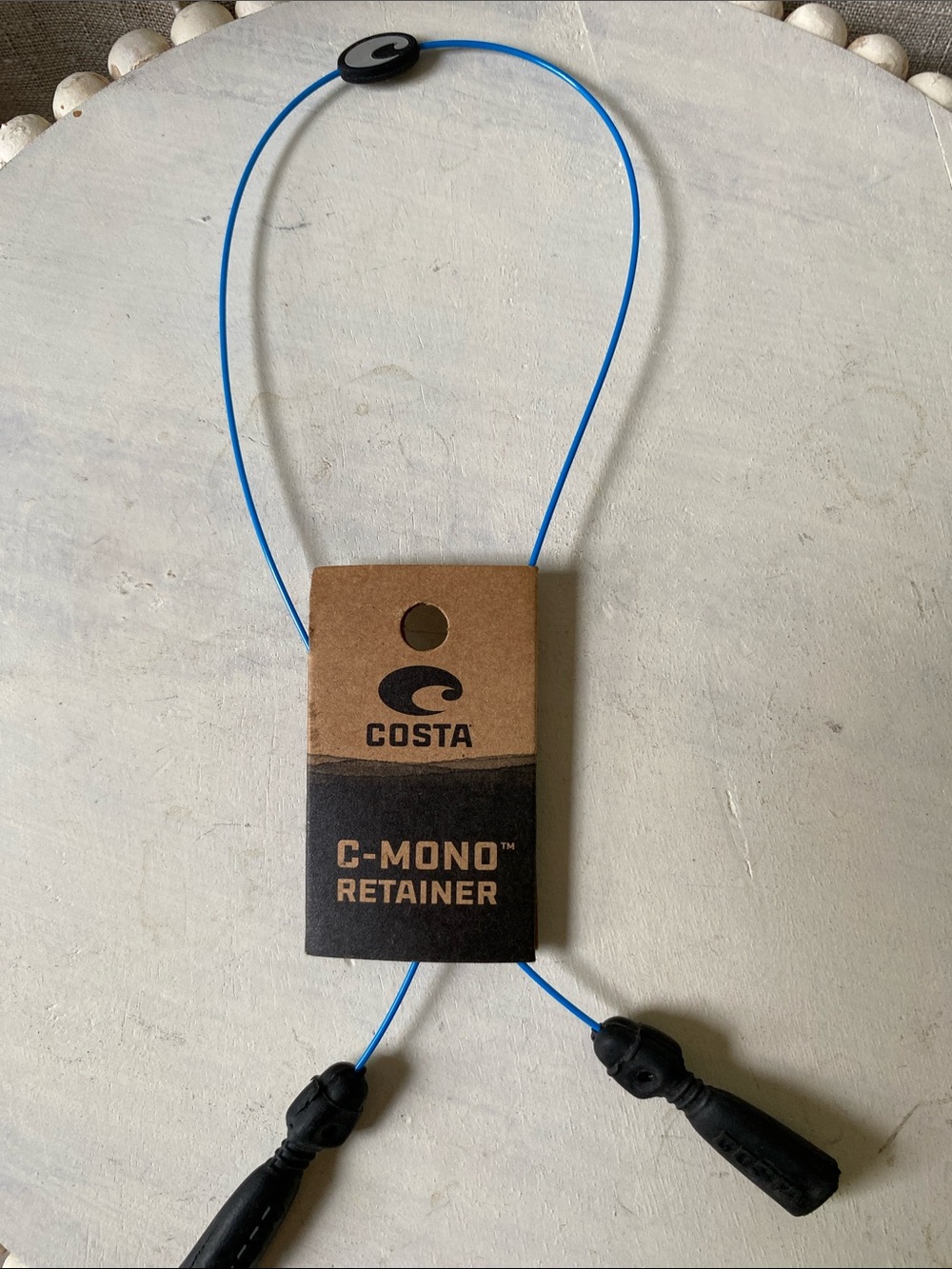 Costa eyewear retainer in bright blue with black grips